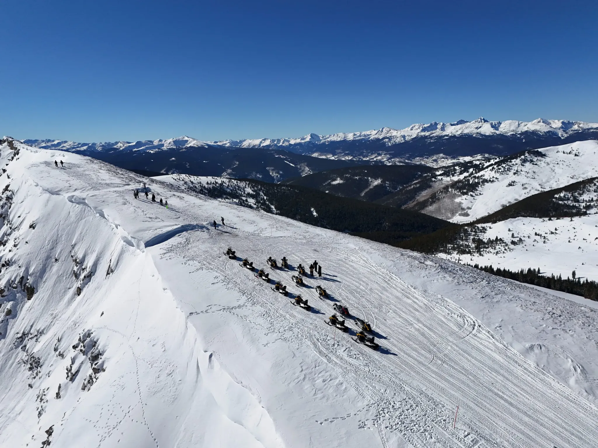Snowmobile riders on a guided tour near Keystone, Silverthorne, and Dillon, Colorado.